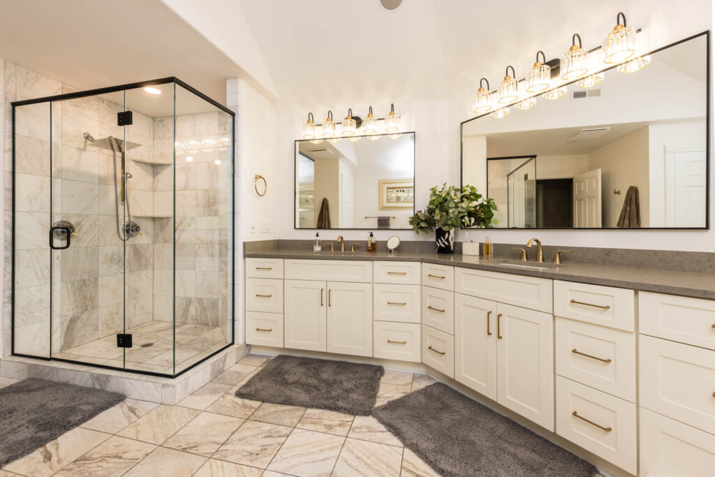 Dublin bathroom remodel with tiled floors and cream colored cabinets