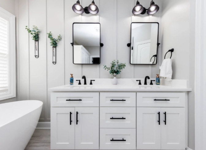 White Bathroom Remodel with Quartz countertop and double mirrors in Dublin, Ohio